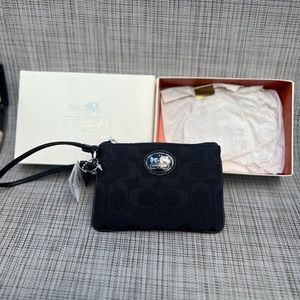 Coach Sutton Signature Wristlet 43996
Black Jacquard Zippered Pouch Leather Trim